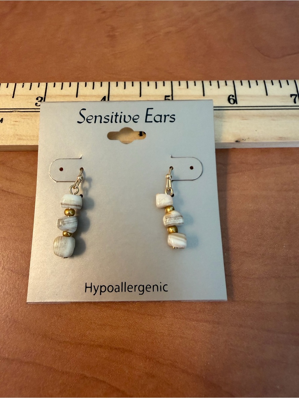 Hypoallergenic quartz drop earrings with gold tone spacer beads. Approx 1 inch